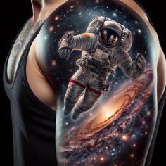 an astronaut in outer space is depicted on the arm and back of a man's body