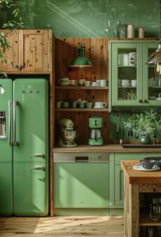 a kitchen with green cabinets and wooden floors is pictured in this image, there are plants growing on the shelves