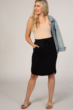 A basic skirt with side pockets and an elastic drawstring waist. The Black Maternity Skirt is perfectly bump-friendly! Casual Lined Mini Pencil Skirt, Casual Mini Pencil Skirt With Lining, Casual Lined Pencil Mini Skirt, Casual Skirt With Elastic Waistband For Everyday, Casual Everyday Skirt With Elastic Waistband, Drawstring Skirt For Day Out, Casual Knee-length Pencil Skirt, Day Out Skirt With Drawstring, Drawstring Mini Skirt For Day Out