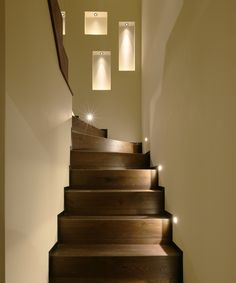 the stairs are made of wood and have lights on each step to illuminate them