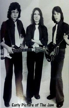 three young men standing next to each other holding guitars and posing for a photo with the caption, early picture of the jam