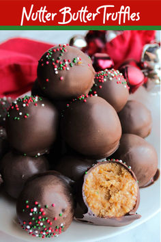 These Nutter Butter truffles feature a fun peanut butter center and chocolate shell. They are made with the namesake cookies and are a super delicious no bake dessert. We make them and Christmas, but they are delicious any time of year. Make a batch to see for yourself. #FeelingFestive24