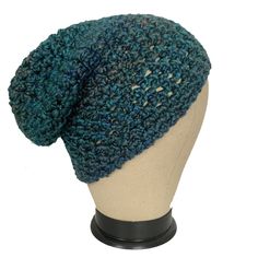 Handmade Hippie Boho Crochet Slouchy Hat made with soft sheen like yarn in versatile colors of dark turquoise with flecks of browns and golds!  Designed to be a versatile accessory, this hat accommodates various hair lengths and styles. Whether you have a short sassy style, long cascades of hair, or short to medium dreadlocks, the slouchy design effortlessly accommodates your individuality.  Great for your Hippie or Skater style.   Who is it for? : Anyone!  The crochet hat's size is thoughtfully tailored to fit both teenagers and adults, spanning across gender boundaries. Its relaxed, yet secure fit has a sense of casual boho hippie skater style that appeals to both women and men seeking an unconventional touch to their wardrobe. What is it made of? : 100% Soft Acrylic Yarn  What size is i Hippie Skater Style, Hippie Skater, Crochet Hat Sizing, Crochet Slouchy Hat, Sassy Style, Unique Gifts For Him, Dark Turquoise, Slouchy Hat, Skater Style