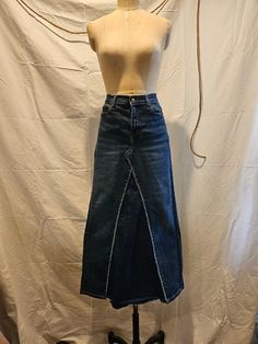 Reconstructed and one-of-a-kind jean skirt made from repurposed jeans.  Original jeans are Banana Republic size 30 waist.  Skirt is form fitting with gradual A-line shape and hem hitting around the ankle.  Can be dressed up or down, and very fun to wear with your favorite boots!  Jean fabric has nice stretch to provide extra comfort. Repurposed Jeans, Jean Fabric, Denim Maxi, Jeans Fabric, Favorite Boots, Denim Maxi Skirt, Jean Skirt, Waist Skirt, Banana Republic