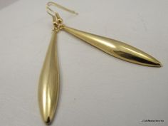 Long, simple and elegant. What a perfect accent to any outfit. These gold plated earrings are so sophisticated and sleek - and so much fun to wear! They are finished off with gold plated ear wires. The ear wires can be switched out to stainless steel, for those with sensitive ears, or gold plated clip-ons at no additional charge. Simply select your option before adding to your cart. Total height from top of ear wire to bottom of the drop is approximately 2.75 inches. Width at the widest point of Modern Gold Teardrop Earrings For Wedding, Elegant Gold Earrings, Etsy Bridesmaid Gifts, Earrings Elegant, Gold Drop Earrings, Gold Plated Earrings, Sensitive Ears, Elegant Earrings, Bridesmaid Gift