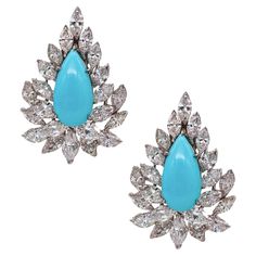 Exceptional gem-set pair of cocktail clips Earrings. A fabulous pair of cluster earrings, crafted in the Hollywood Regency patterns in solid .900/.999 platinum and suited with comfortable French omega backs for fastening clips. The posts option for pierced ears can be easily added. They are embellished with an exceptional selection of gemstones, creating a flamboyant look. The centers are mount in a five-prongs settings, with a pair of pear cabochon cut (18 x 9 x 5 mm) of natural blue turquoises Gem Cluster, Turquoise Gem, Sleeping Beauty Turquoise, My Ancestors, Cluster Earrings, Lovely Jewellery, Jewelry Companies, Light Blue Color, Hollywood Regency