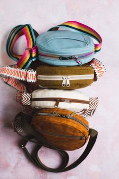 several purses stacked on top of each other