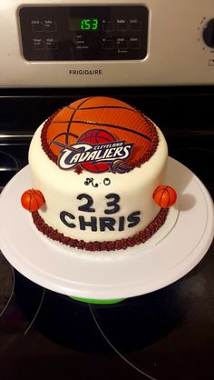 a cake that is on top of a stove with a basketball on the front and number 23 on the side