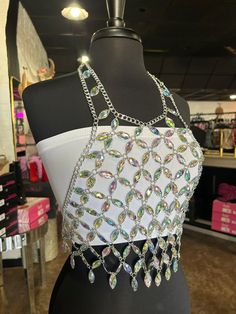 Stand out this Summer in our iridescent Crystal Tank Top! It’s the perfect statement piece to wear to any special occasion- a weekend in Nashville with the girls or a Summer concert with your boyfriend either way you will stand out! Perfect to pair any color bandeau underneath! bodychain tank top; one size fits most Trendy White Tank Top For Party, Summer Night Out Tops With Bling, Rave Crop Top For Spring Party, Summer Club Tops With Rhinestone Fringe, Glamorous Summer Tank Top With Rhinestones, Rhinestone Halter Top For Summer, Summer Rhinestone Tank Top For Night Out, Glamorous Rhinestone Tank Top For Summer, Summer Party Rave Tank Top