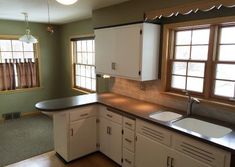 the kitchen is clean and ready for us to use as a dining room or office