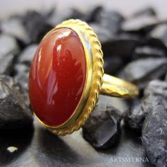 ARTSMYRNA METAL: 925k Silver GEM: Carnelian ( lab created ) Diameter Stone Size: 14x10 mm COATING: 24k gold over (We can made a special type of coating for your personal preference ) MATERIEL : 925K Sterling Silver ( Some of my items vermeil gold over silver for looks rich . But i can finish in silver too ) RING SIZE: 6 (your desired size is made) SPECIAL ORDER IS MADE. If you send us a photo of your desired model (you can send your gem.) We can do it for you. We can make any design you want wit Elegant Round Carnelian Jewelry, Traditional Round Carnelian Rings, Polished Carnelian Ring, Silver Carnelian Rings With Polished Finish, Collectible Red Carnelian Ring, Carnelian Ring, How To Look Rich, Bee Pendant, Silver Signet Ring