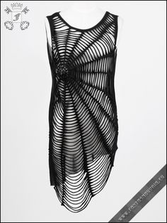 a black and white photo of a dress on a mannequin