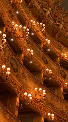 an ornately decorated auditorium with chandeliers