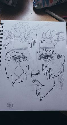 a drawing of a woman's face with flowers on her head