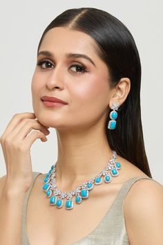 Silver plated floret design zircon encrusted necklace with turquoise blue stones embellishments. Comes with a pair of floret dangler earrings. - Aza Fashions Dangler Earrings, Blue Stones, Jewellery Sets, Fashion App, Jewellery Set, Mixed Metals, Blue Stone, Aza Fashion, Turquoise Blue