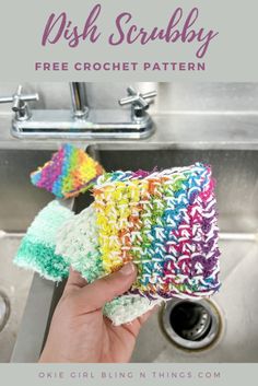 a hand holding a crochet dish scrubby in front of a kitchen sink