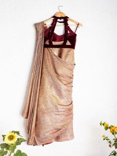 Shimmer Maroon And Gold Prestitched Saree With Sequence Blouse (Set of 2) By Anisha Shetty now available at Trendroots Bollywood Style Pre-draped Saree With Padded Blouse, Floor-length Raw Silk Saree With Unstitched Blouse, Party Pre-draped Saree In Raw Silk With Unstitched Blouse, Party Pre-draped Raw Silk Saree With Unstitched Blouse, Traditional Pre-draped Saree With Padded Blouse For Wedding, Pre-draped Fitted Raw Silk Saree With Unstitched Blouse, Fitted Raw Silk Pre-draped Saree With Self Design, Fitted Floor-length Raw Silk Pre-draped Saree, Festive Art Silk Saree With Padded Blouse