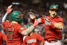 the baseball players are congratulating each other