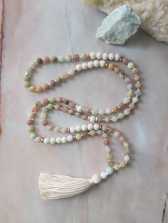 ◈ Each Mala purchase will include a card describing the stones healing properties and a Mantra card ◈ WHAT IS A MALA? Malas are traditionally used for Meditation and Prayer. These 108 bead Malas are made with semi-precious stones that hold beautiful energy within each stone. 108 is significant for so many reasons and there are many interpretations for the number 108. Some say that there are 108 stages on the journey of the human soul while others believe 108 centering breaths will bring enlighte Mala Necklace Design, Mala Ideas, Mala Beads Diy, Mala Making, Pearl Mala, Beautiful Energy, Tassel Necklace Boho, Jewlery Necklace, Mala Beads Bracelet