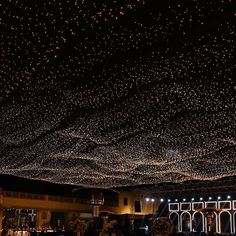 the ceiling is covered with hundreds of lights