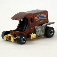 a toy truck with an open door on the front and side, painted red and gold