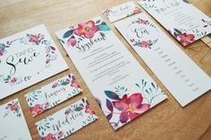 the wedding stationery is laid out and ready for guests