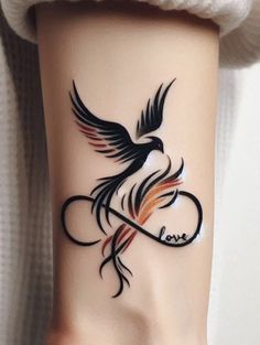 a woman's arm with a tattoo on it that has a bird and the word love