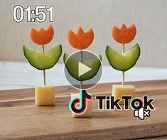 the video is showing how to make fake flowers out of popsicles and cheese