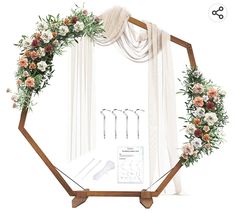 a mirror with some flowers on it and other decorations in front of the mirror,