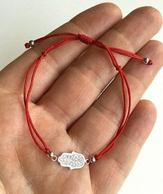 925 sterling silver hamsa red bracelet .adjustable . for protection ,good luck and prosperty. --comes with free gift pouche. pulsera rojo de plata esterlina 925 mano de fatima . ajustable. para proteccion ,buena suerte y prosperidad. --gratis bolsa de regalo. Red Bracelet With Adjustable Chain As Gift, Red Bracelet With Adjustable Chain For Gift, Spiritual Red Resizable Jewelry, Nickel-free Red Sterling Silver Bracelet, Red Spiritual Jewelry With Adjustable Cord, Sterling Silver Bracelets With Adjustable Cord Gift, Adjustable Red Nickel-free Bracelets, Adjustable Nickel-free Red Bracelet, Adjustable Red Nickel-free Bracelet