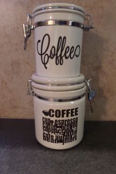 three coffee buckets stacked on top of each other with the words coffee written on them