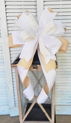 a chair with a large bow on it