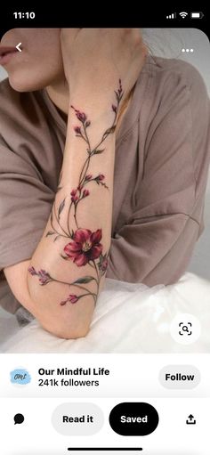 a woman with a flower tattoo on her arm