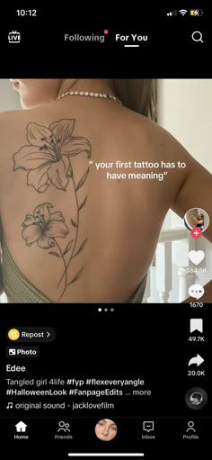 the back of a woman's body with tattoos on it