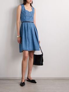 Givenchy's mini dress is part of the label's 'Voyou' collection - the slim satin belt captures the same feel of the decorative buckled straps that define the line. It's made from denim and has a décolletage-framing sweetheart neckline and flattering seams. The pleats enhance the movement of the skirt. Chic Belted Knee-length Denim Dress, Chic Knee-length Belted Denim Dress, Chic Fitted Belted Denim Dress, Chic Belted Sleeveless Denim Dress, Chic Sleeveless Belted Denim Dress, Elegant Belted Denim Dress, Elegant Denim Daywear Dress, Elegant Denim Dress For Daywear, Chic Belted Denim Dress For Summer