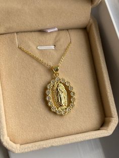 ♡ This stunning piece features a delicately detailed depiction of the Virgin Mary, showcasing her serene presence and gentle expression. Made from a durable and high-quality material that is resistant to tarnishing, this necklace will remain radiant and lustrous, ensuring it stands the test of time! ♡ Pendant size: 2.5cm x 1.8cm ♡ Does not tarnish ♡ Gold Stainless Steel ♡ Chain length: 45 cm/ 17.7 inch We understand the importance of finding meaningful jewelry that reflects one's beliefs, and that's why we've designed this necklace with the utmost care and attention to detail. The durable material ensures that this piece will endure the wear and tear of everyday life, while its tarnish-resistant properties ensure it retains its radiant glow. This Virgin Mary Necklace also makes a thoughtfu Virgin Mary Pendant Necklace, Gold Jewelry Accessories, Virgin Mary Necklace Gold, Jewelry Photography Tutorial, Gold Virgin Mary Necklace, Mary Necklace Gold, Mother Mary Necklace, Dope Jewelry Accessories, Virgin Mary Pendant