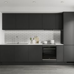 a kitchen with black cabinets and white counter tops, along with a stove top oven