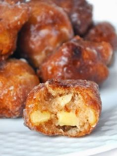 a white plate topped with doughnut holes