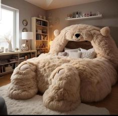 a large teddy bear bed in the middle of a room with white rugs on the floor