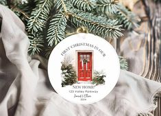 a personalized christmas ornament hanging from a fir tree with the words merry christmas in our home on it