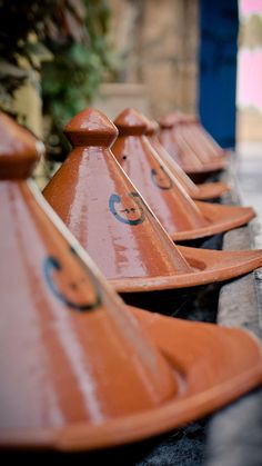 a row of orange benches sitting next to each other