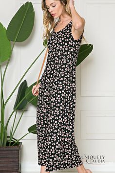 Get picnic ready in our casual-cool style EDGY PLUS: Maria Flower Power Jumpsuit! This feminine flower power ultra-soft and lightweight knit falls from wide tank straps, into a chic v-neck and rounded back. The sleeveless bodice leads into wide pant legs that hits you above the ankles, plus hidden side pockets...perfect for the woman on the go! Unlined 86% Polyester, 12% Rayon, and 2% Spandex Hand Wash Cold. Do Not Bleach. Hang or Line Dry. Imported Also available in Misses