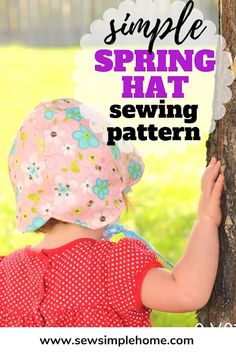 a young child wearing a pink hat and holding onto a tree trunk with the words, simple spring hat sewing pattern