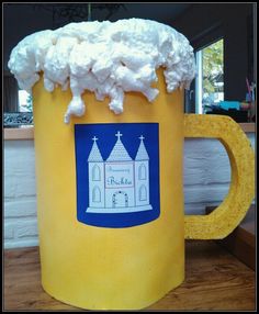 a beer mug with whipped cream on top