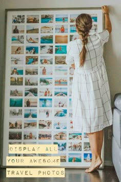 a woman standing in front of a wall with pictures on it and the words display all your awesome travel photos