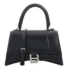 Balenciaga Ladies Handbag. SKU: 5935461QJ4Y1000. Color: Black. Size: L: 9" x H: 5.5" x W: 3.9". Balenciaga Black Leather Small Hourglass Box Handbag. Made from shiny box calfskin, the Hourglass bag features a magnet closure with aged-silver B logo, a nappa lambskin lining, curvilinear base, long flap, adjustable and removable crossbody strap with 21.6" drop, 1 handle, 1 back pocket, 1 inner patch pocket and 1 inner zipped pocket. Made in Italy. Box Handbag, Balenciaga Black, B Logo, Logo A, Versace Watch, Denim Shoes, Fragrance Gift Set, Crossbody Messenger Bag, Small Handbags