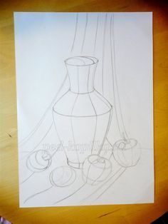 a drawing of a vase and apples on a table next to a pen and paper