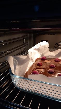 chocolate cake with raspberries in the oven ready to be baked into the oven