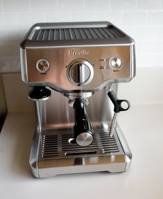 an espresso machine sitting on top of a counter