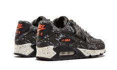 Considered one of the best Nike Air Max collaborations ever, this collab between Nike and Japanese sneaker shop atmos materialized in 2013.  The tiger camo edition of the Air Max 90 features a black leather base with camo graphics and reflective detailing, all completed with orange accents and a speckled midsole. Air Maxes, Nike Casual, Sneaker Shop, Air Max 90 Premium, Orange Accents, Fresh Kicks, Stadium Goods, The Tiger, Mens Sportswear